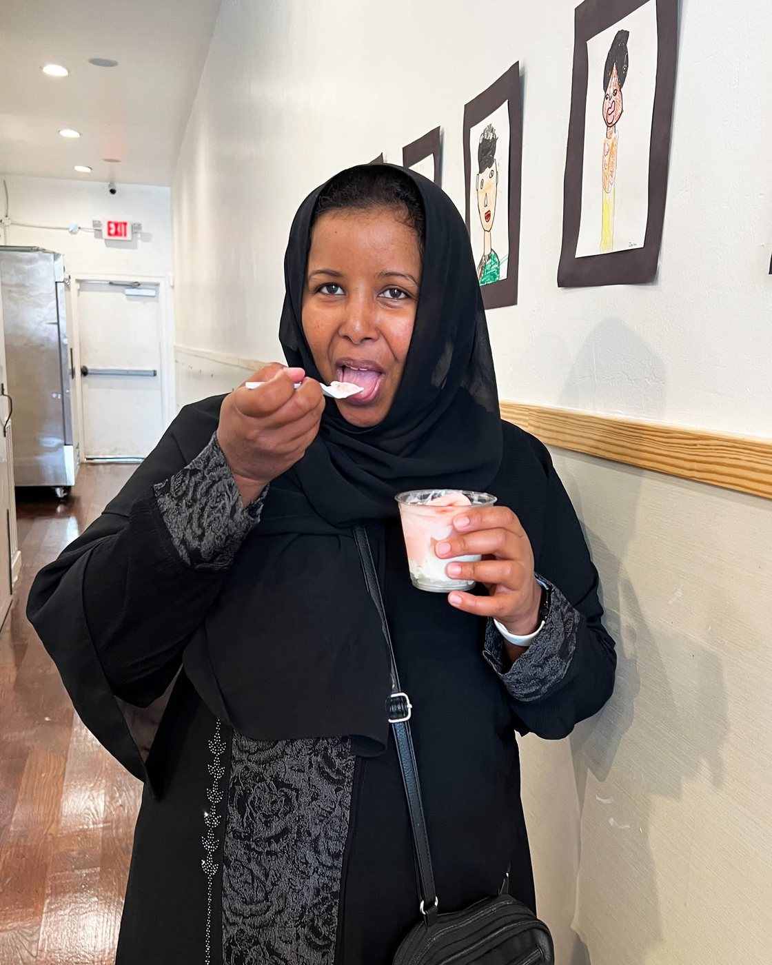 A guest enjoying a cup of ice cream at The Bee