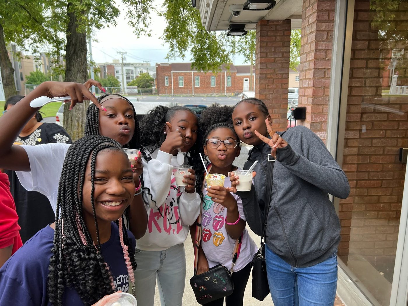 A group of friends with ice cream outside The Bee