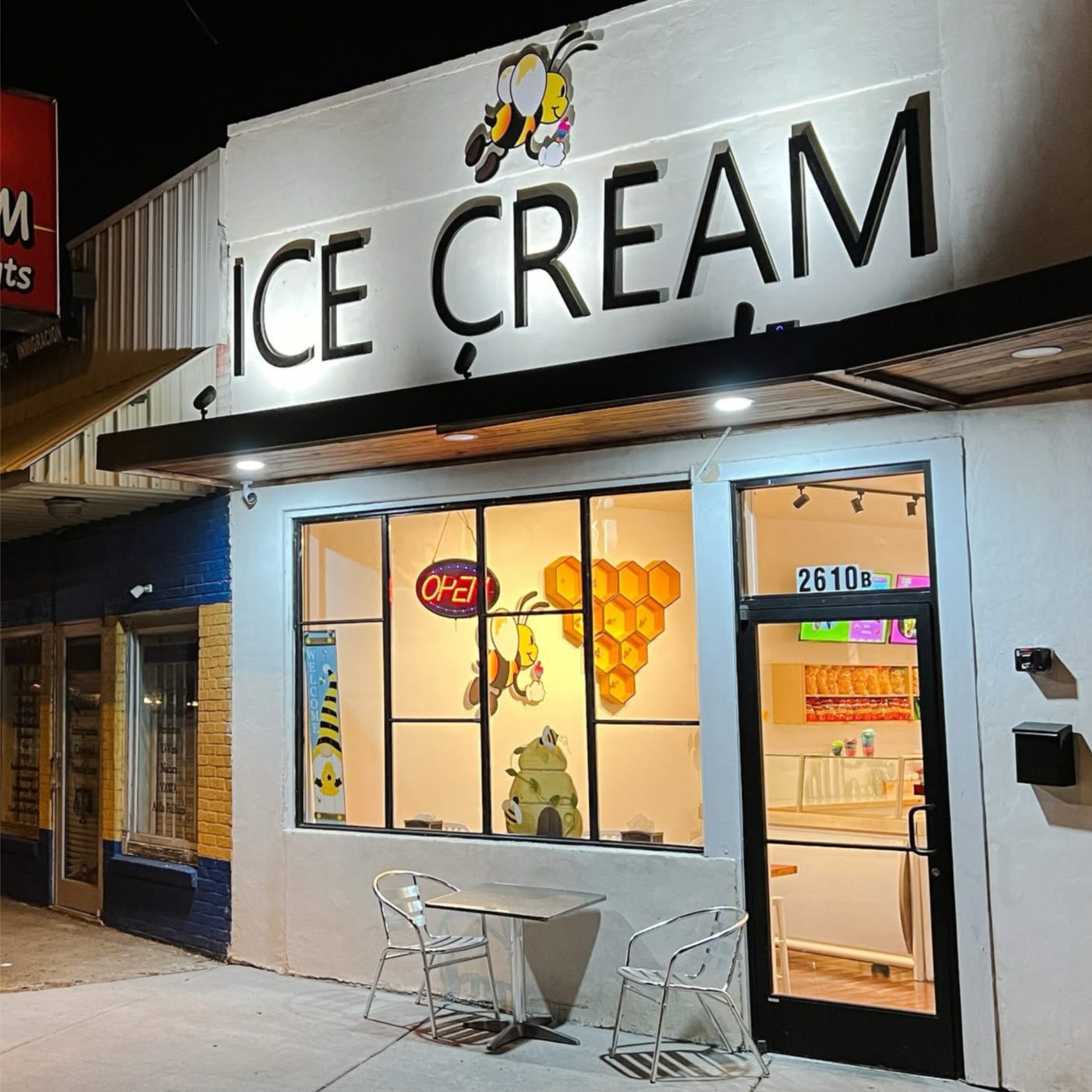 The Bee Ice Cream entrance lit up at night on Nolensville Pike