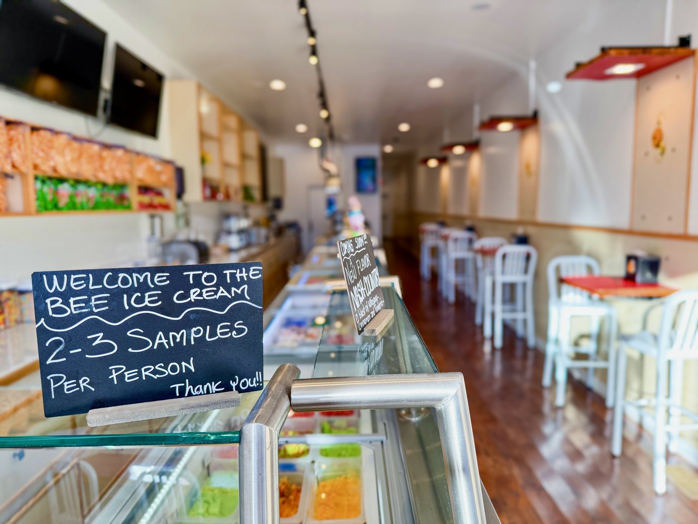 The welcome sign over the ice cream case inside The Bee Ice Cream